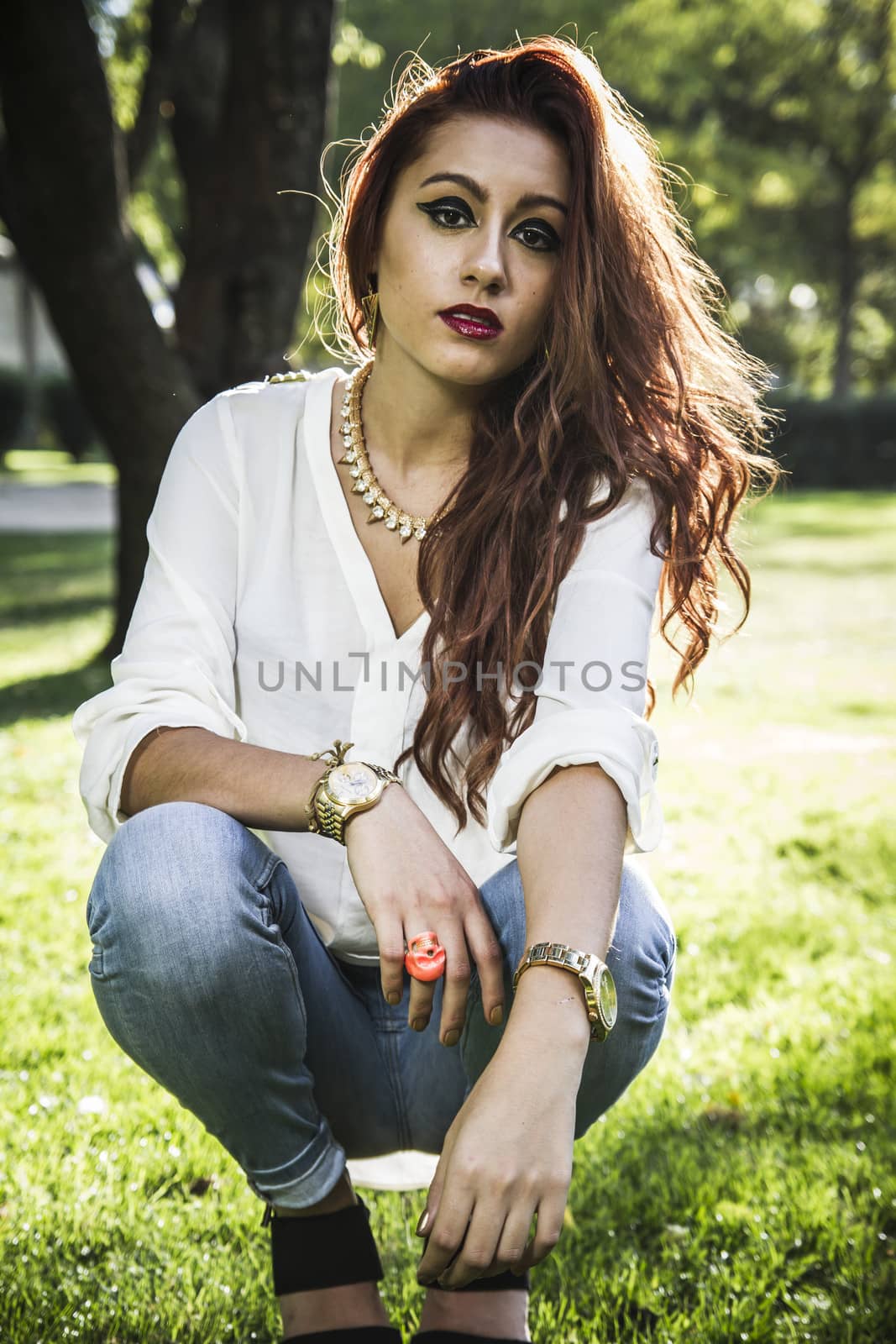 Portrait of pensive beautiful young woman, against background of by FernandoCortes