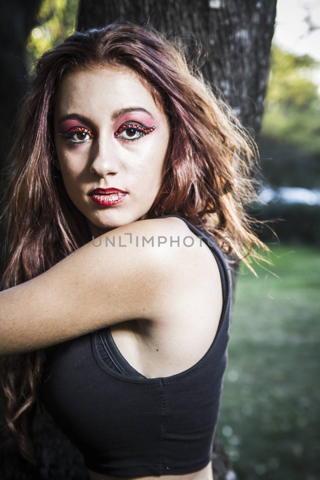 beautiful girl in a vintage style in a fabulous autumn park