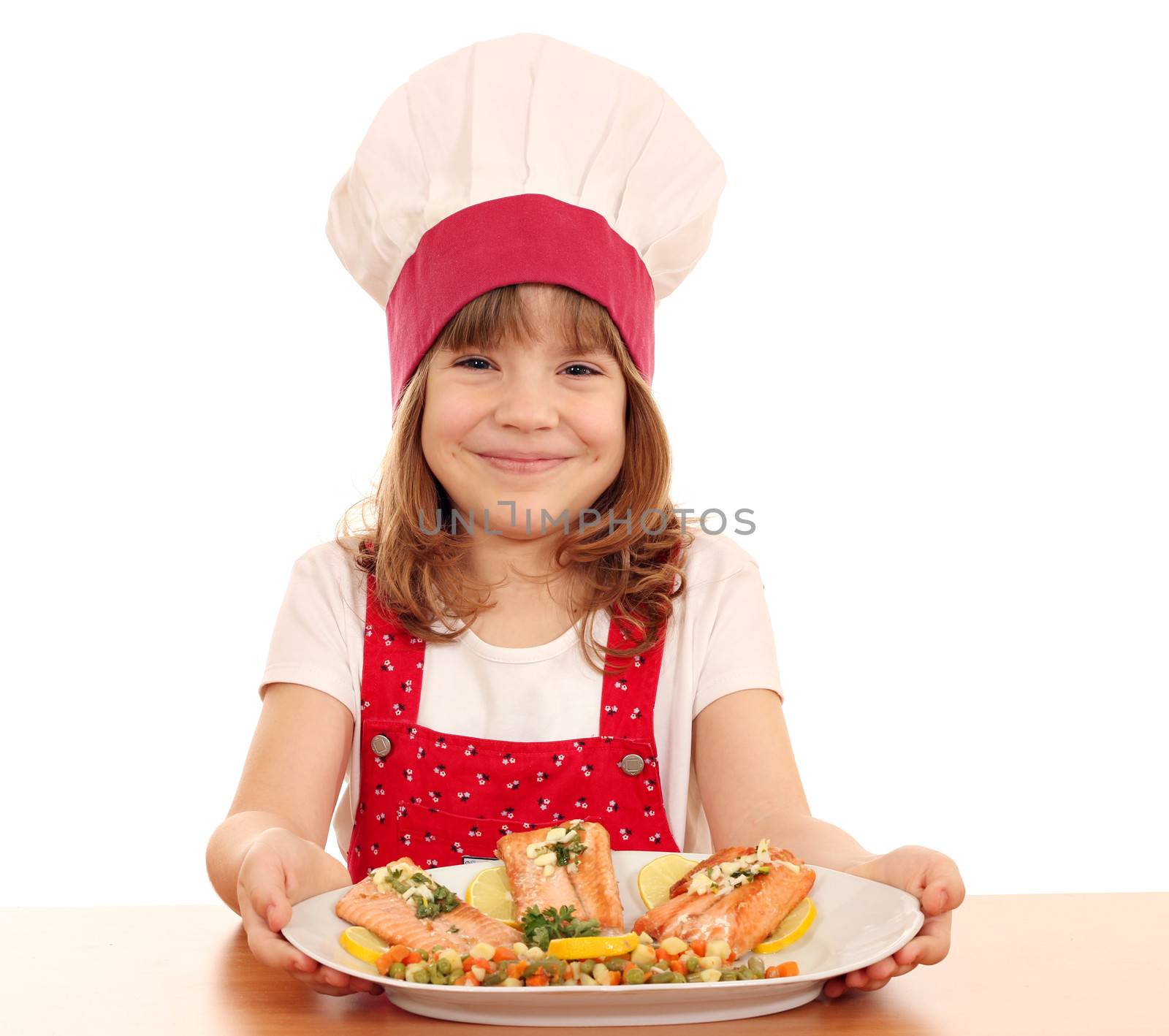 happy little girl cook with salmon seafood by goce