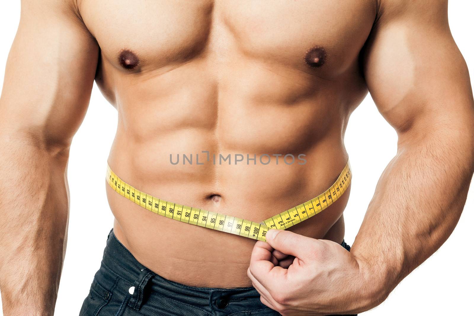 An image of a handsome young muscular sports man measure