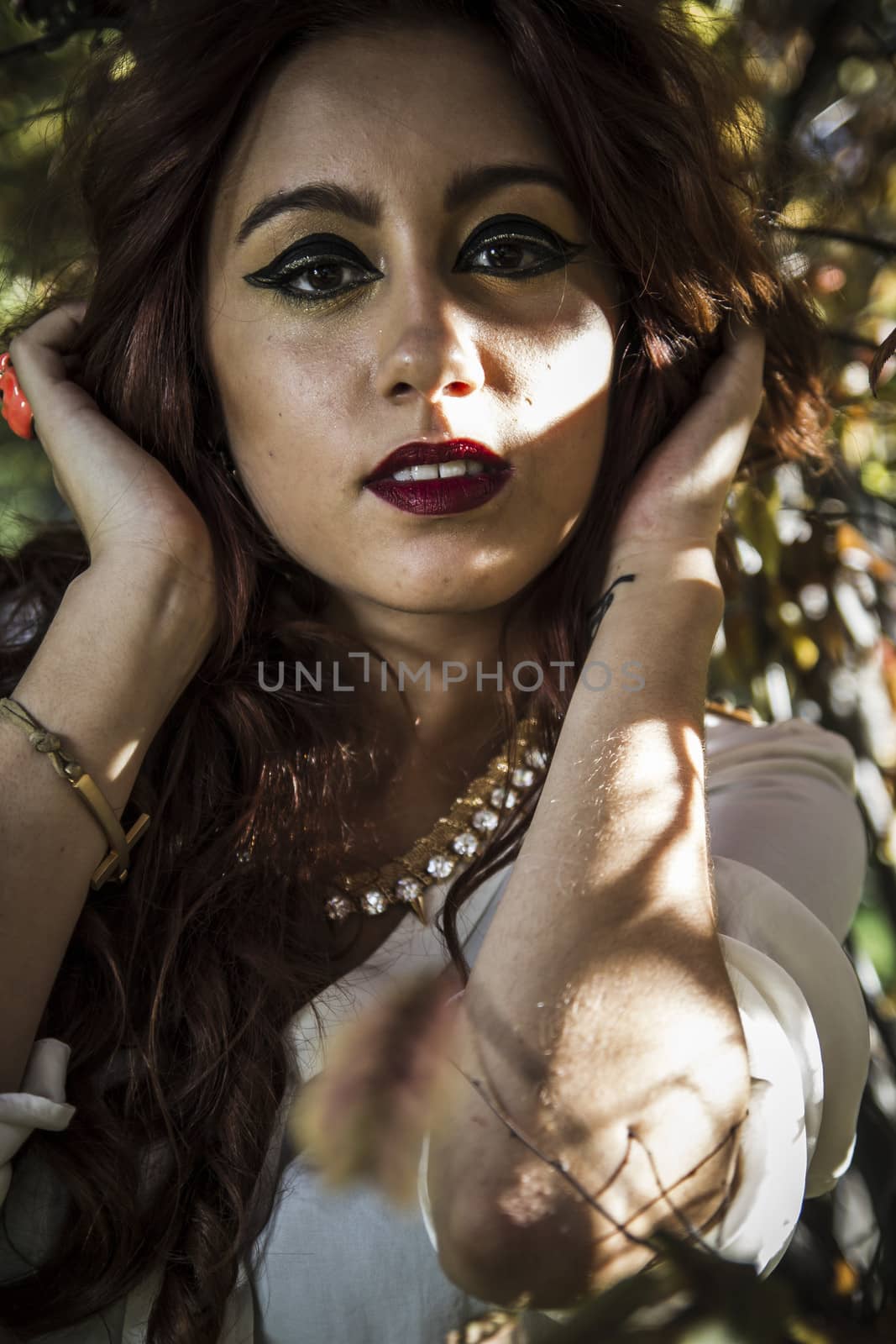 Carefree cheering woman in spring or summer forest park full of by FernandoCortes