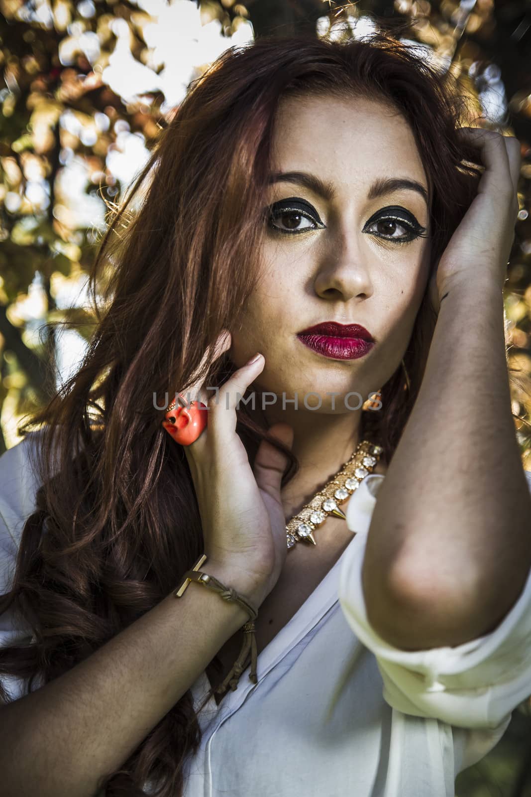 Portrait of pensive beautiful young woman, against background of by FernandoCortes