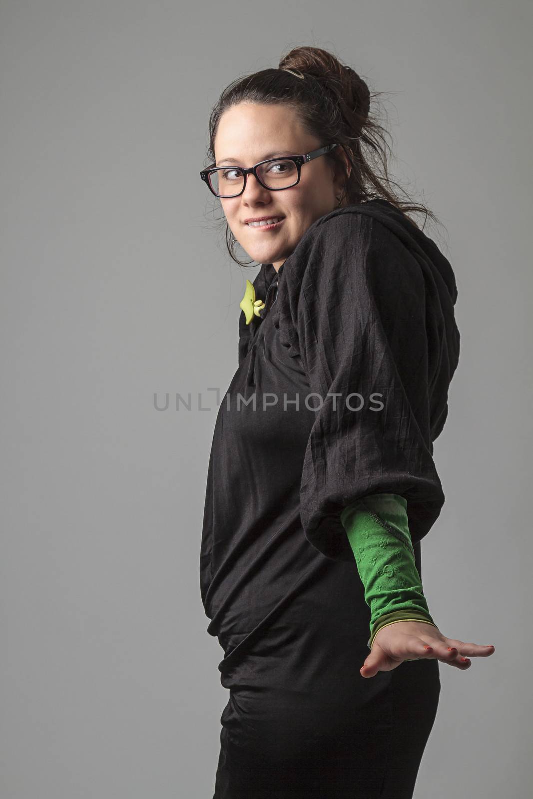 thirty something woman with the look of someone trying to sneaking around