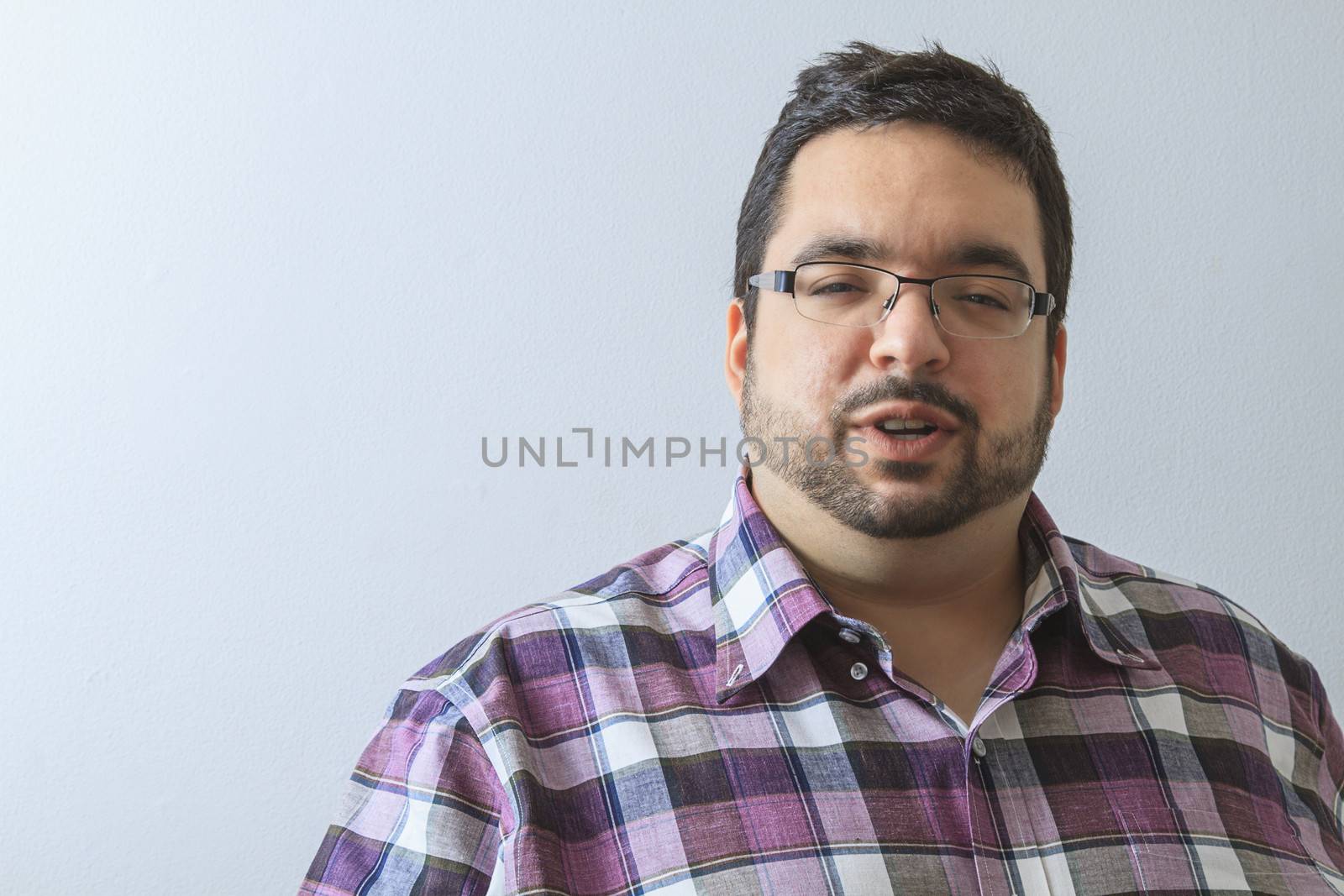 young overweight man in middle of discussion