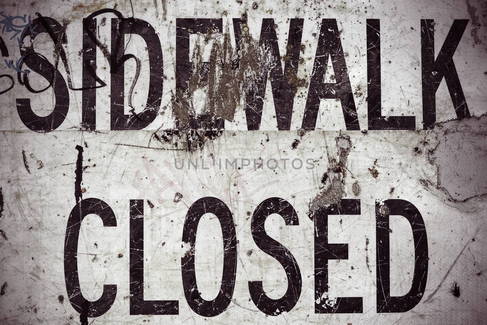 A Grungy Sidewalk Closed Sign From A USA Highway