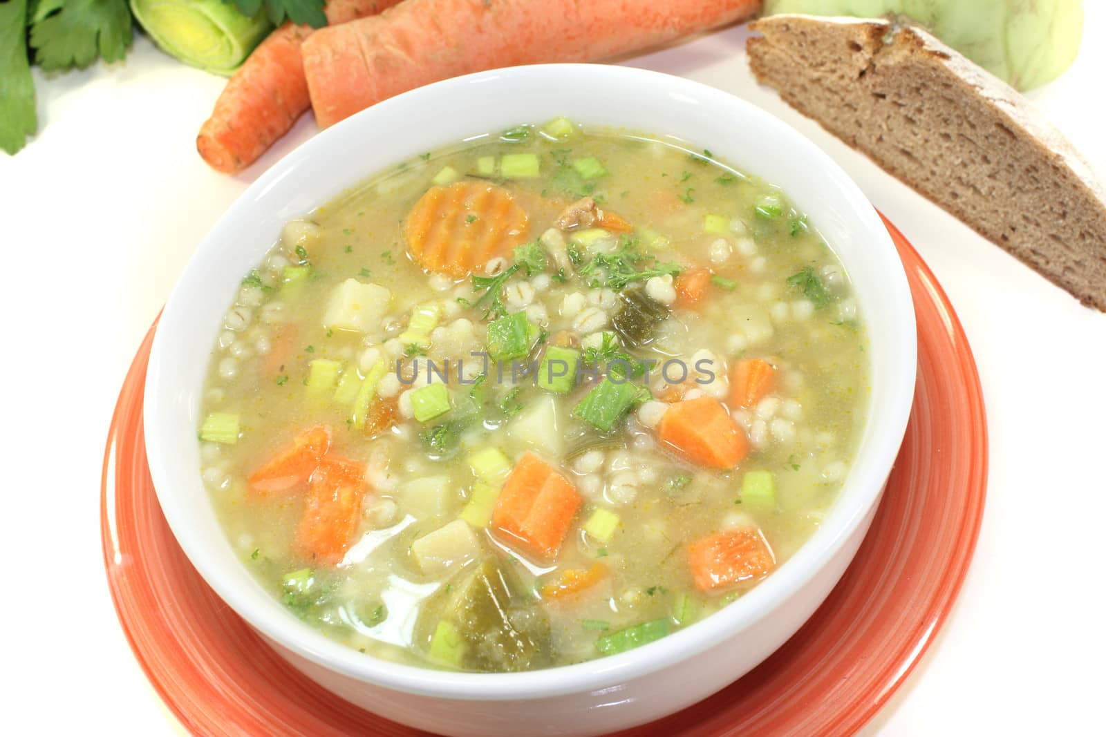 fresh delicious Barley porridge with bread on a light background