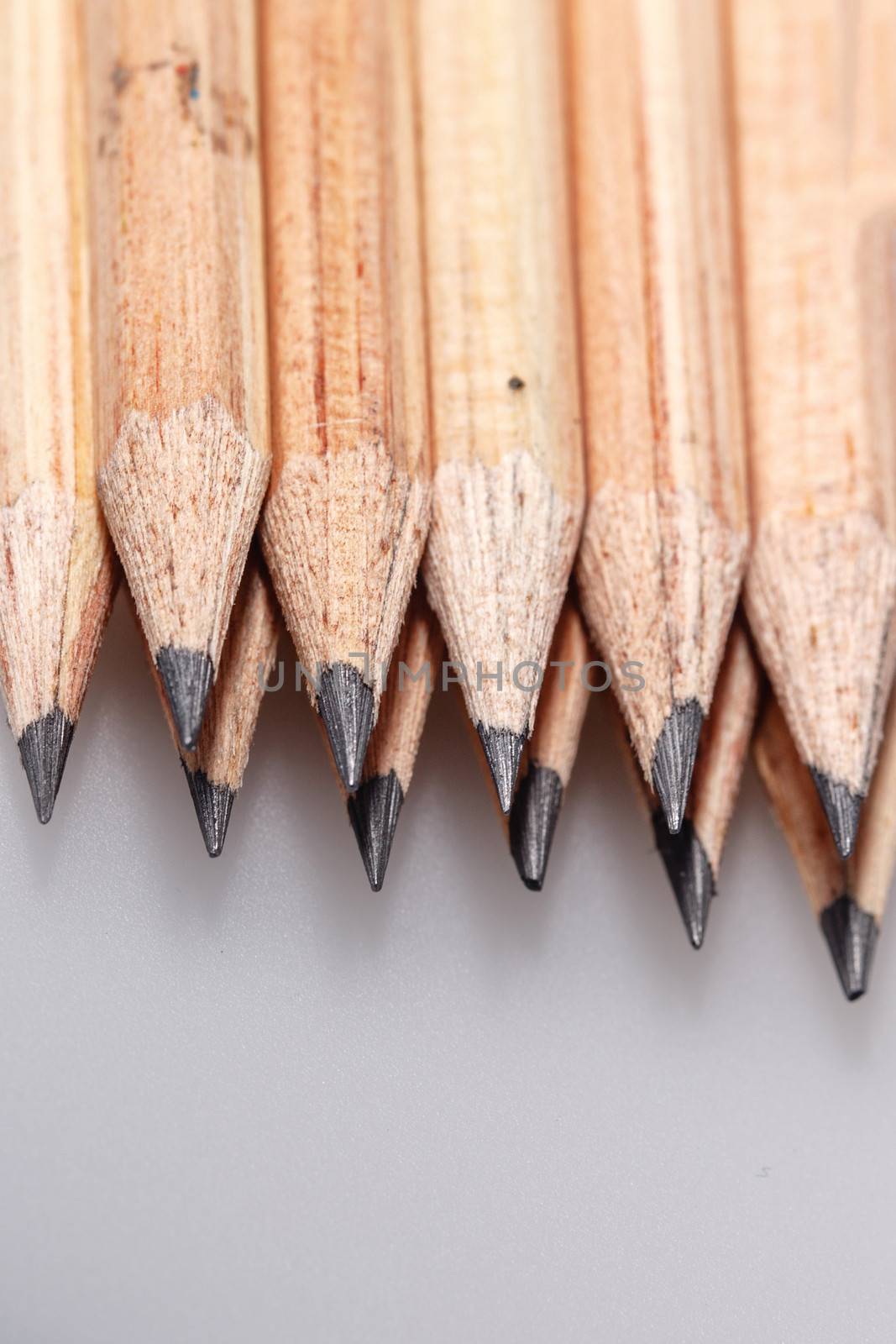 Graphite wooden pencils for sketching shot closeup background