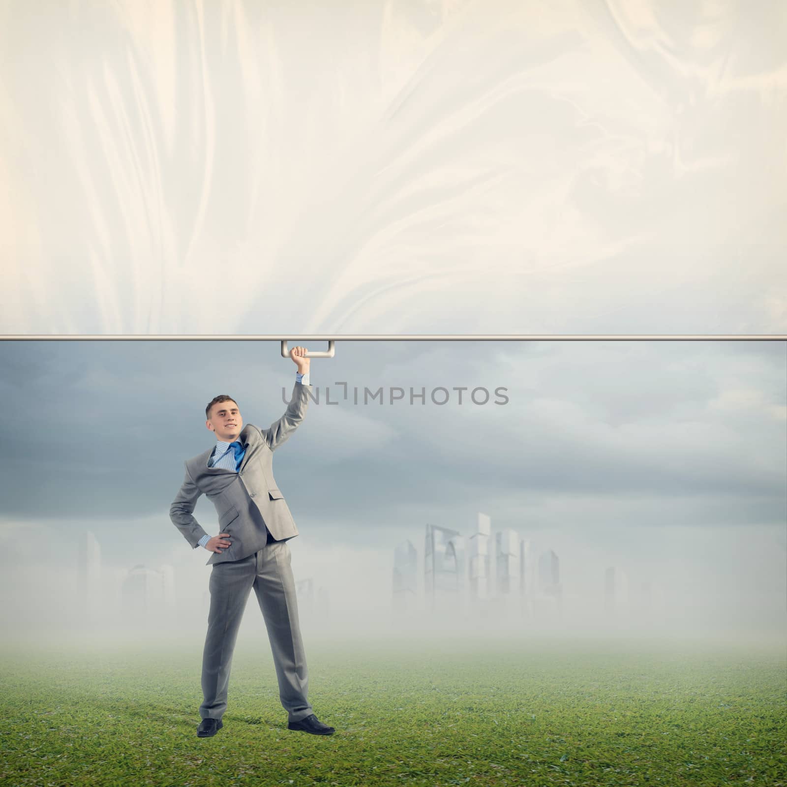 image of a businessman holding a banner with one hand, place for text