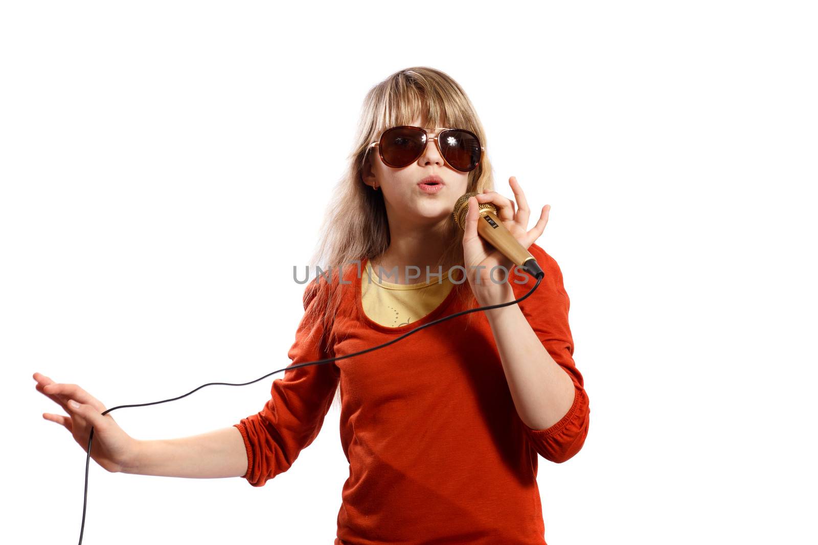 girl sings into a microphone on a white background