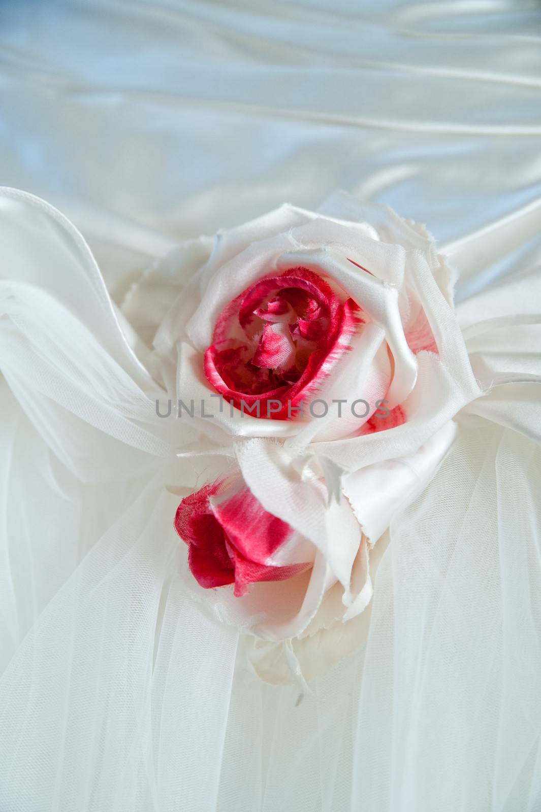 beautiful white wedding dress detail with flower