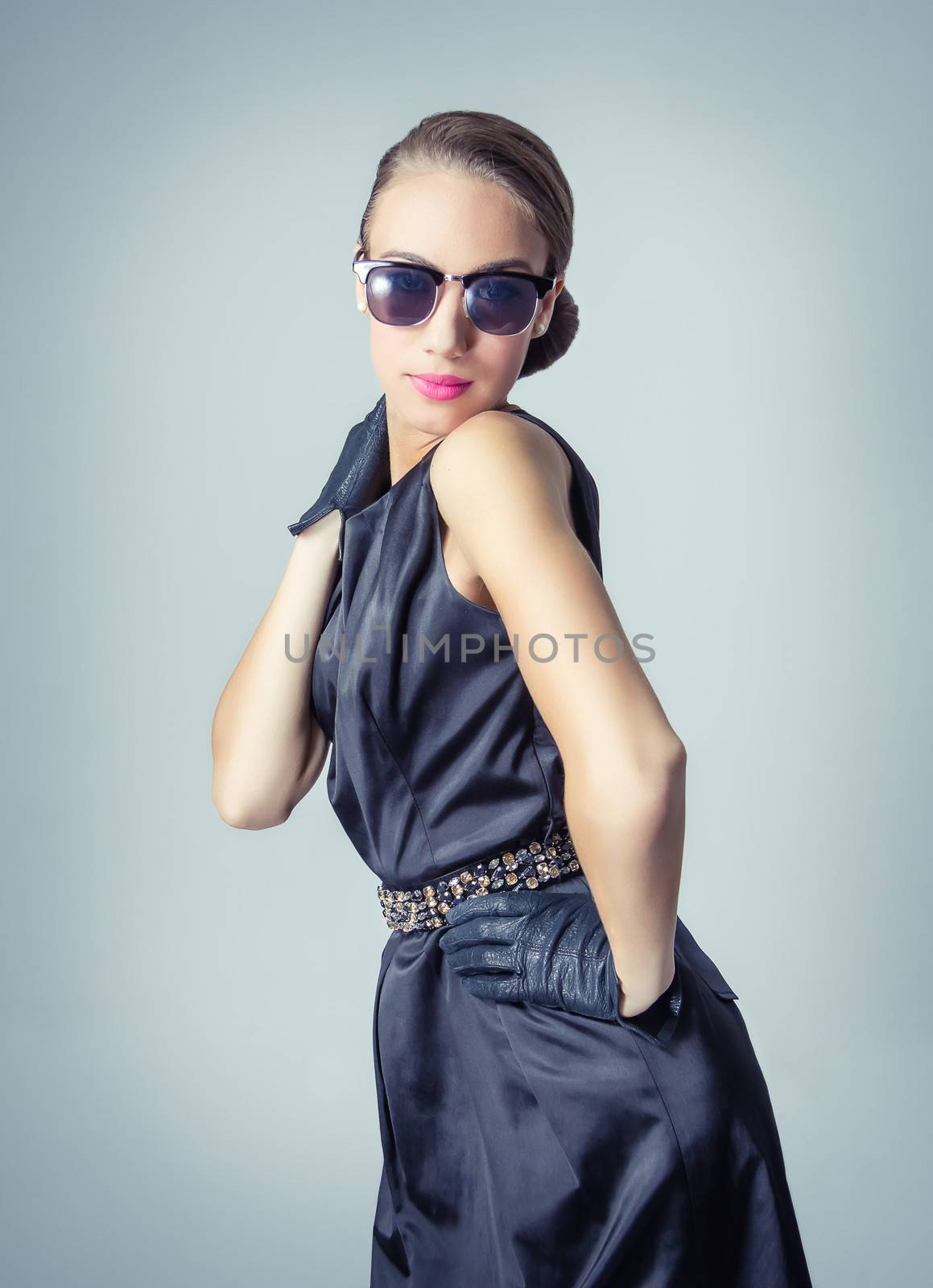 Fashion portrait of beautiful young girl with sunglasses in classic vintage style