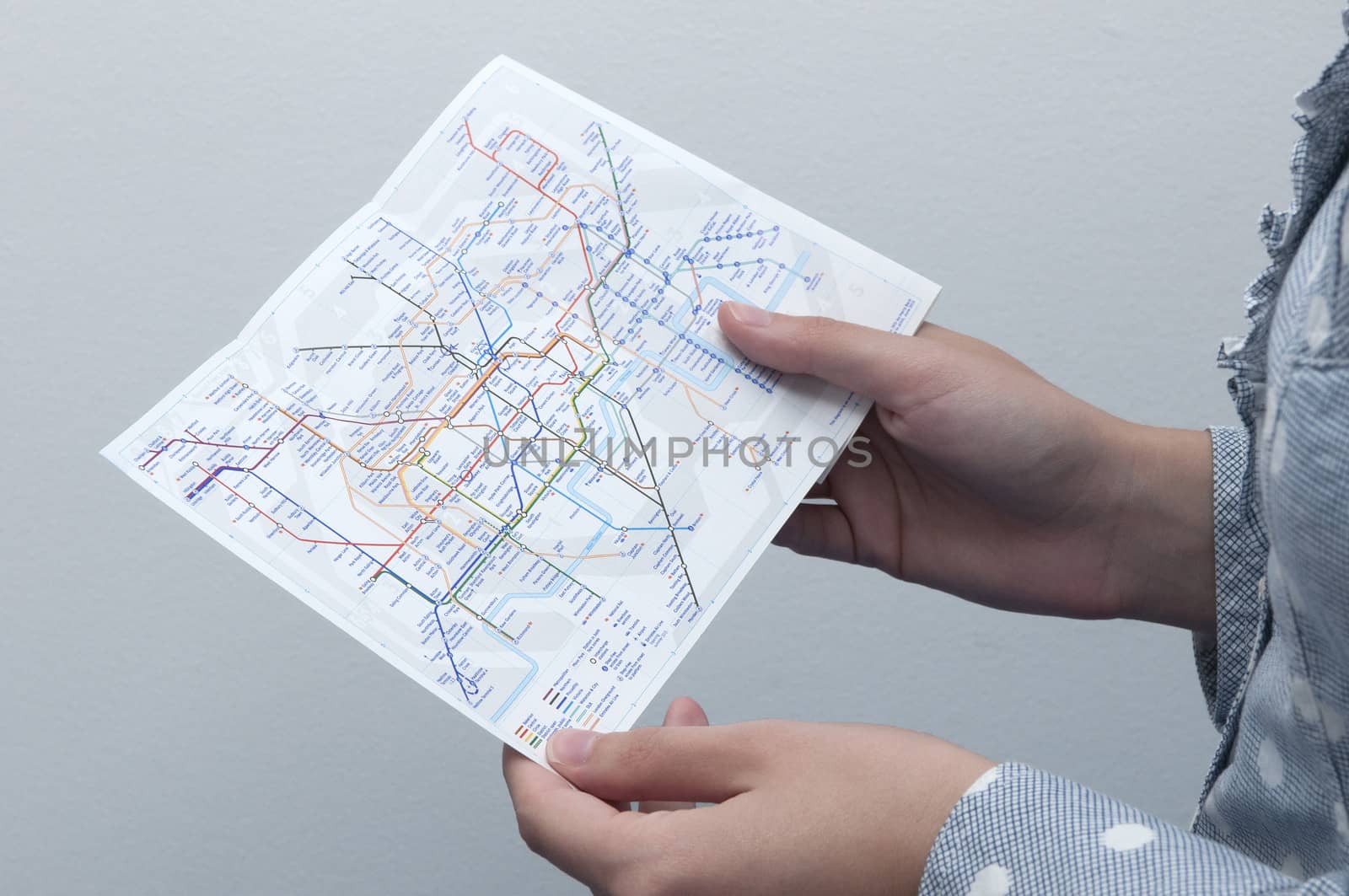 Woman looking to the Tube Map (London Underground) by rodrigobellizzi