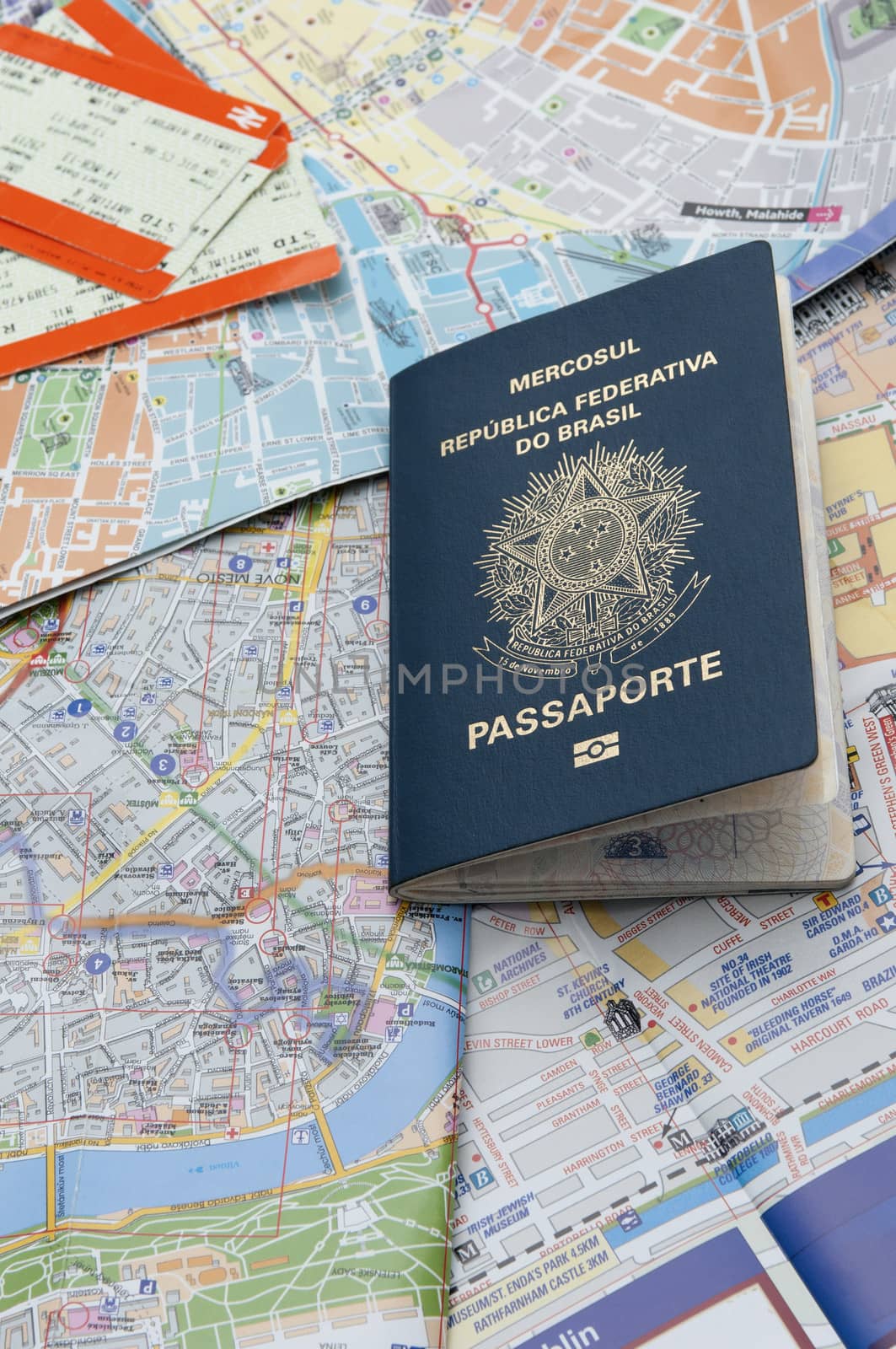 Passport, maps, and tickets on the table