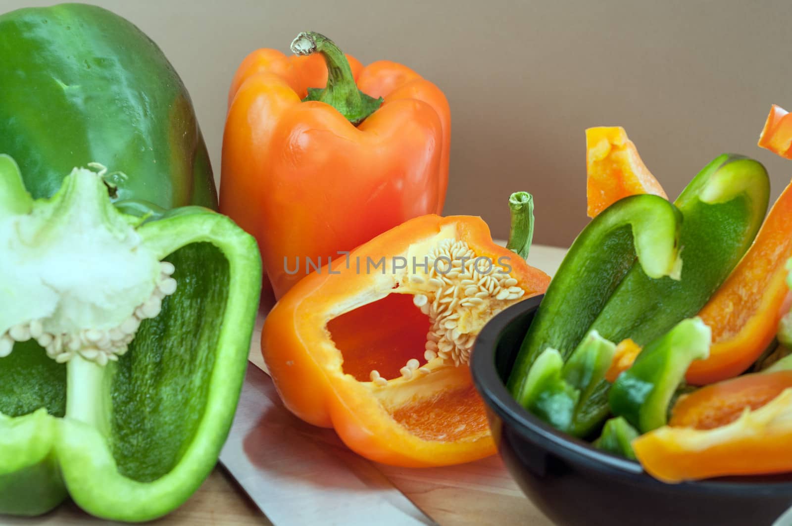 Green and Orange Peppers Sliced by edcorey
