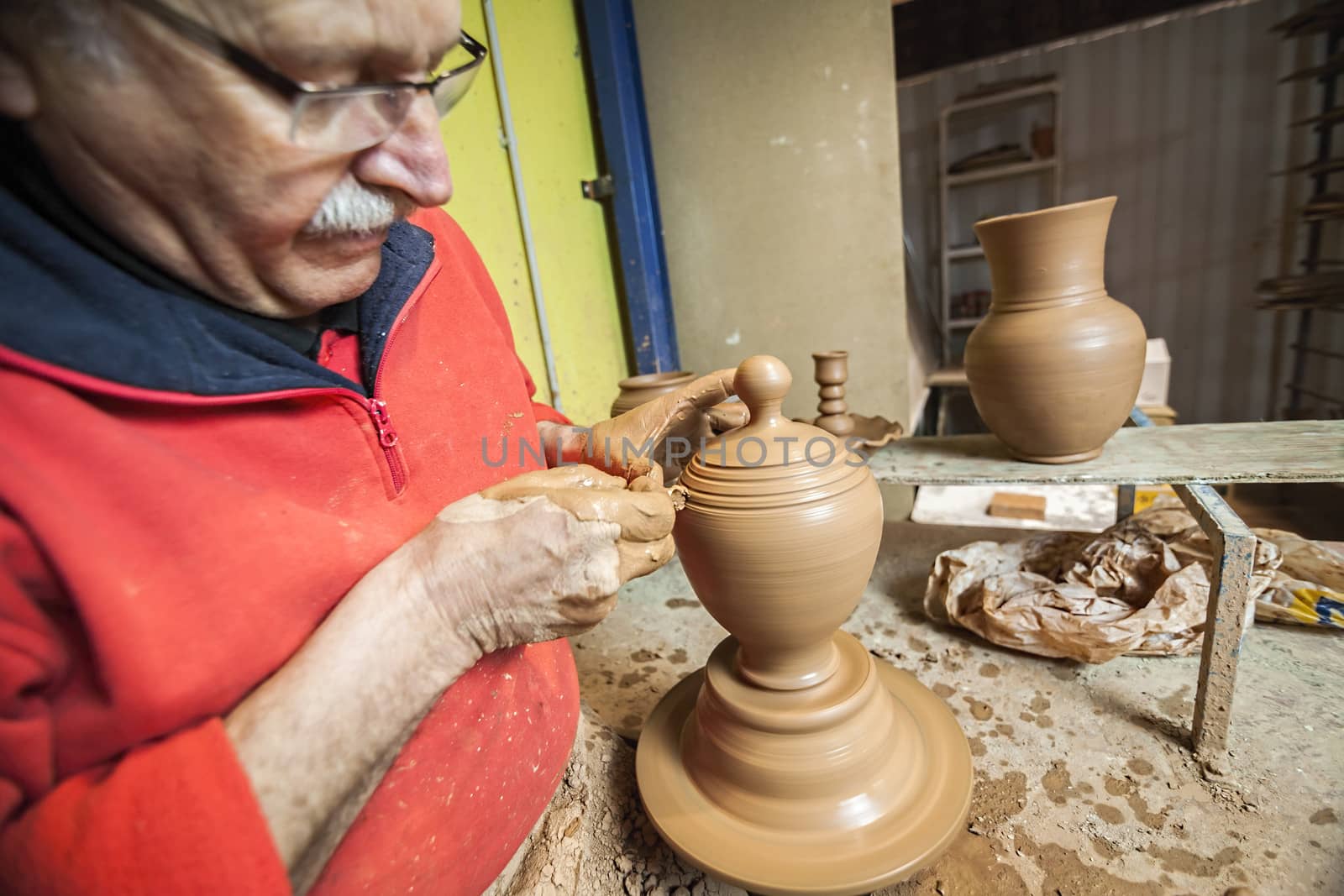 Potter making a jug of mud, clay pottery ceramics typical of Bailen, Jaen province, Andalucia, Spain