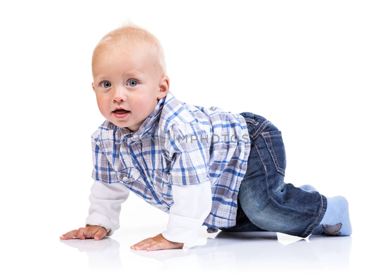Cute baby boy crawling on a white background