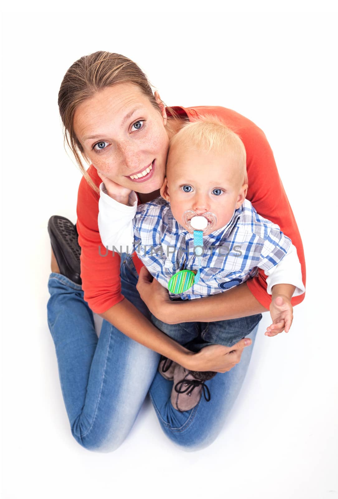 Young Caucasian woman and her baby son over white background