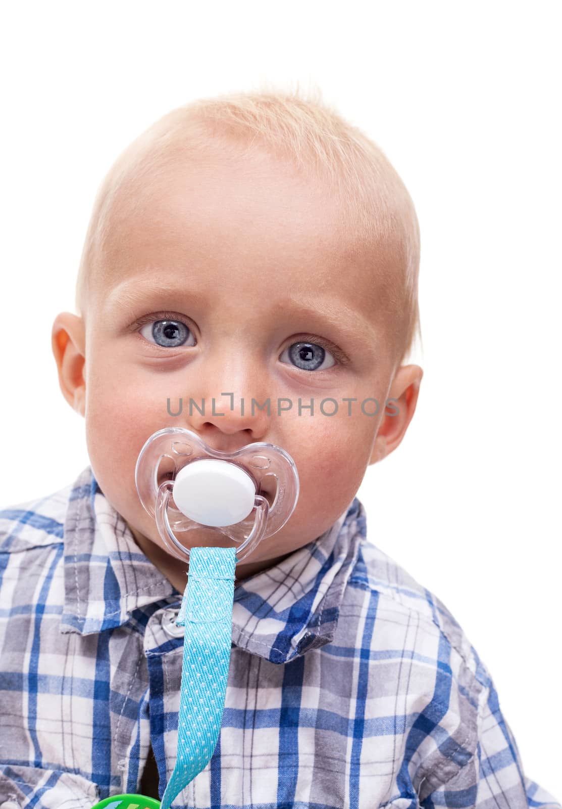 Closeup of cute blonde blue-eyed little boy with a pacifier over white background