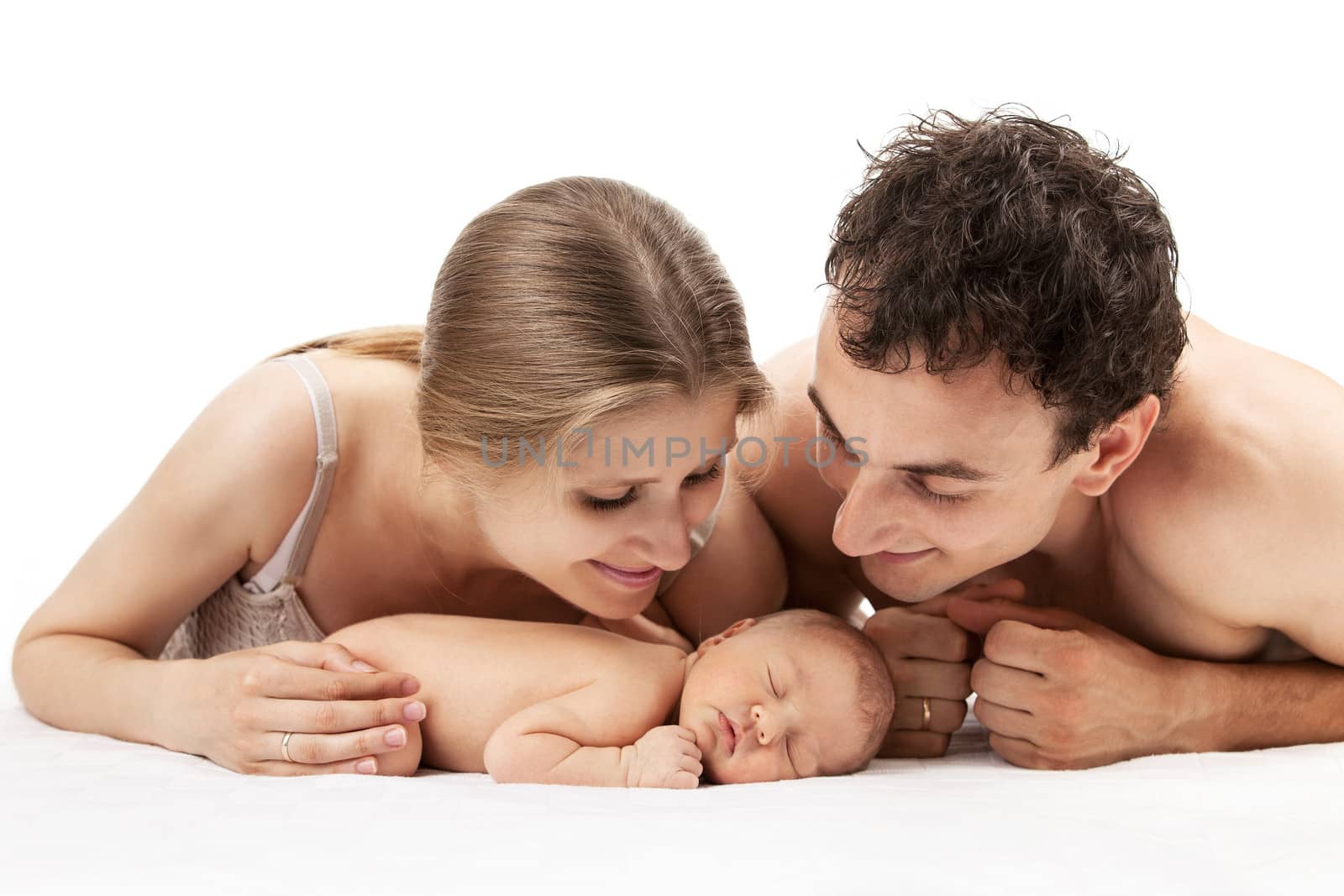 Young caucasian couple with one week old boy by photobac