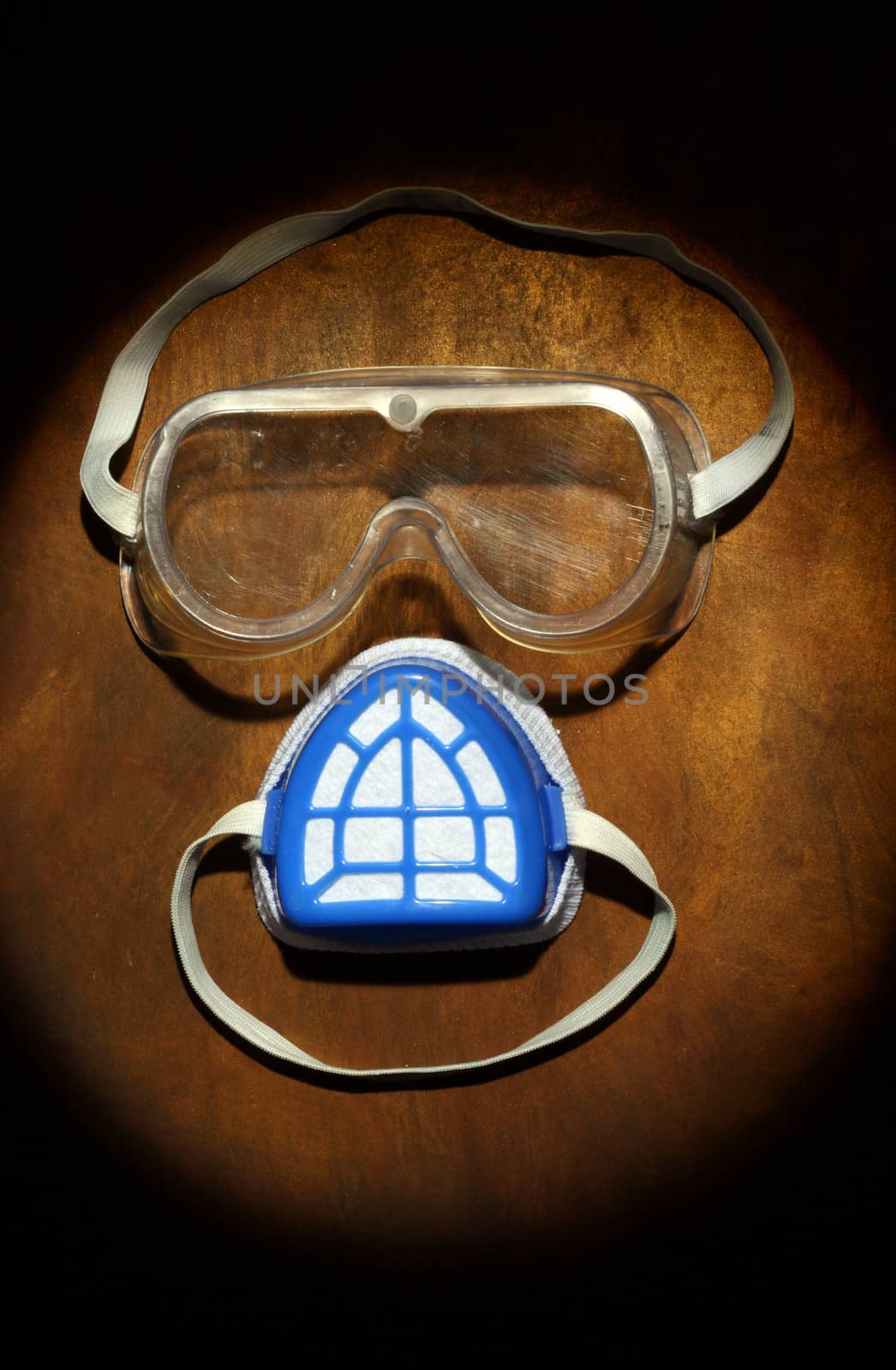 goggles and a mask as a human face. safety concept