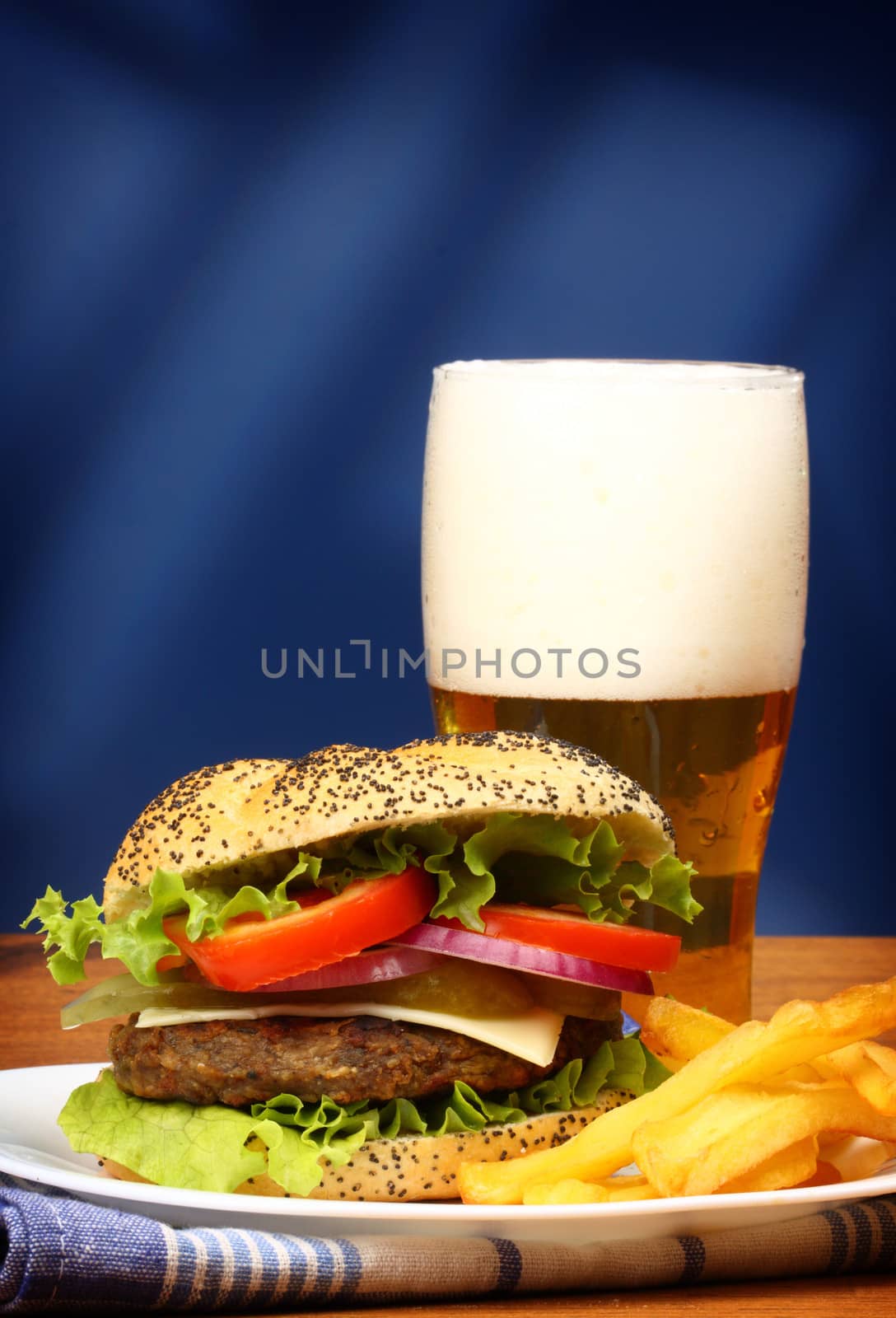 Close up of big tasty burger, french fries and beer