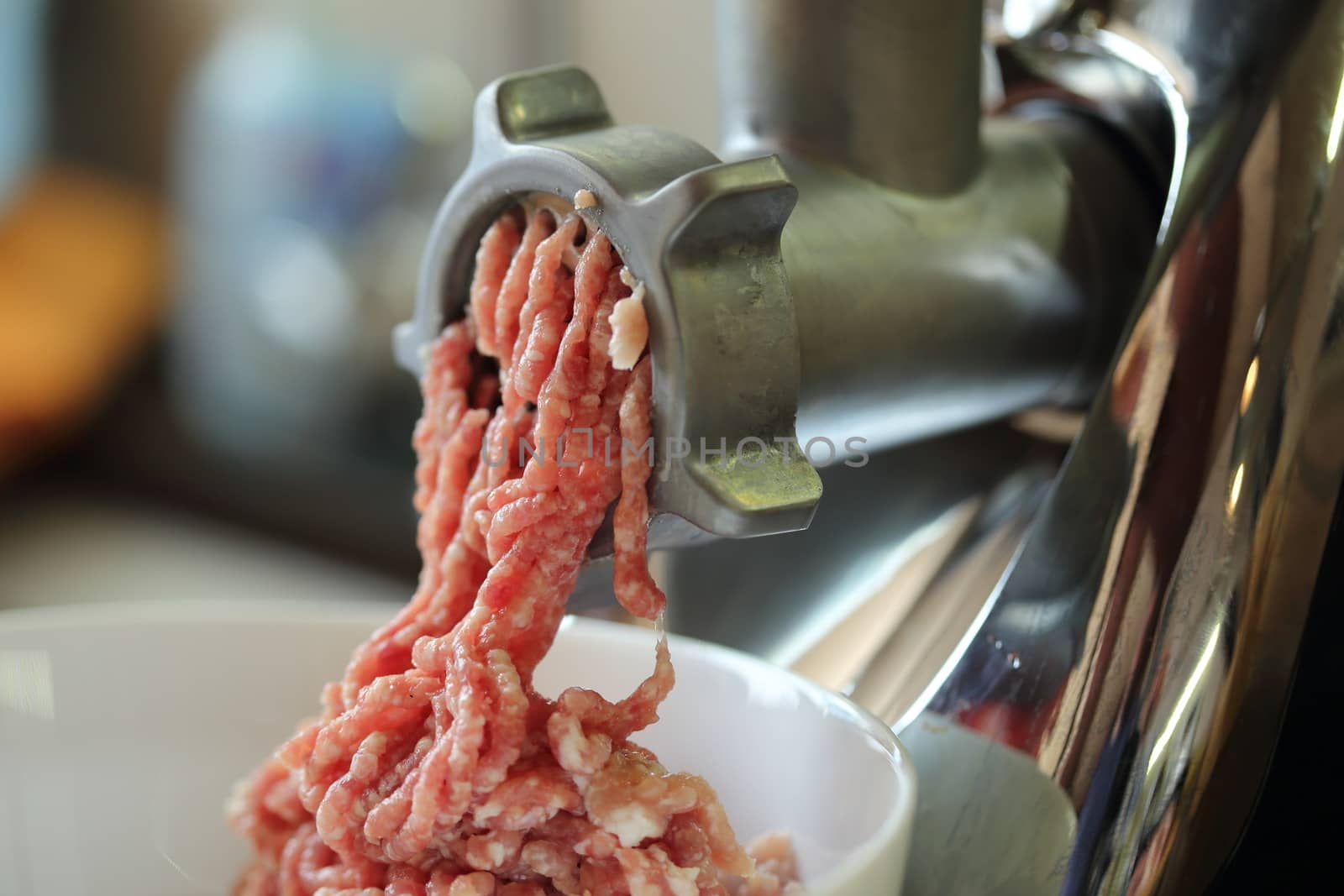 Meat grinder close up, preparation of forcemeat 