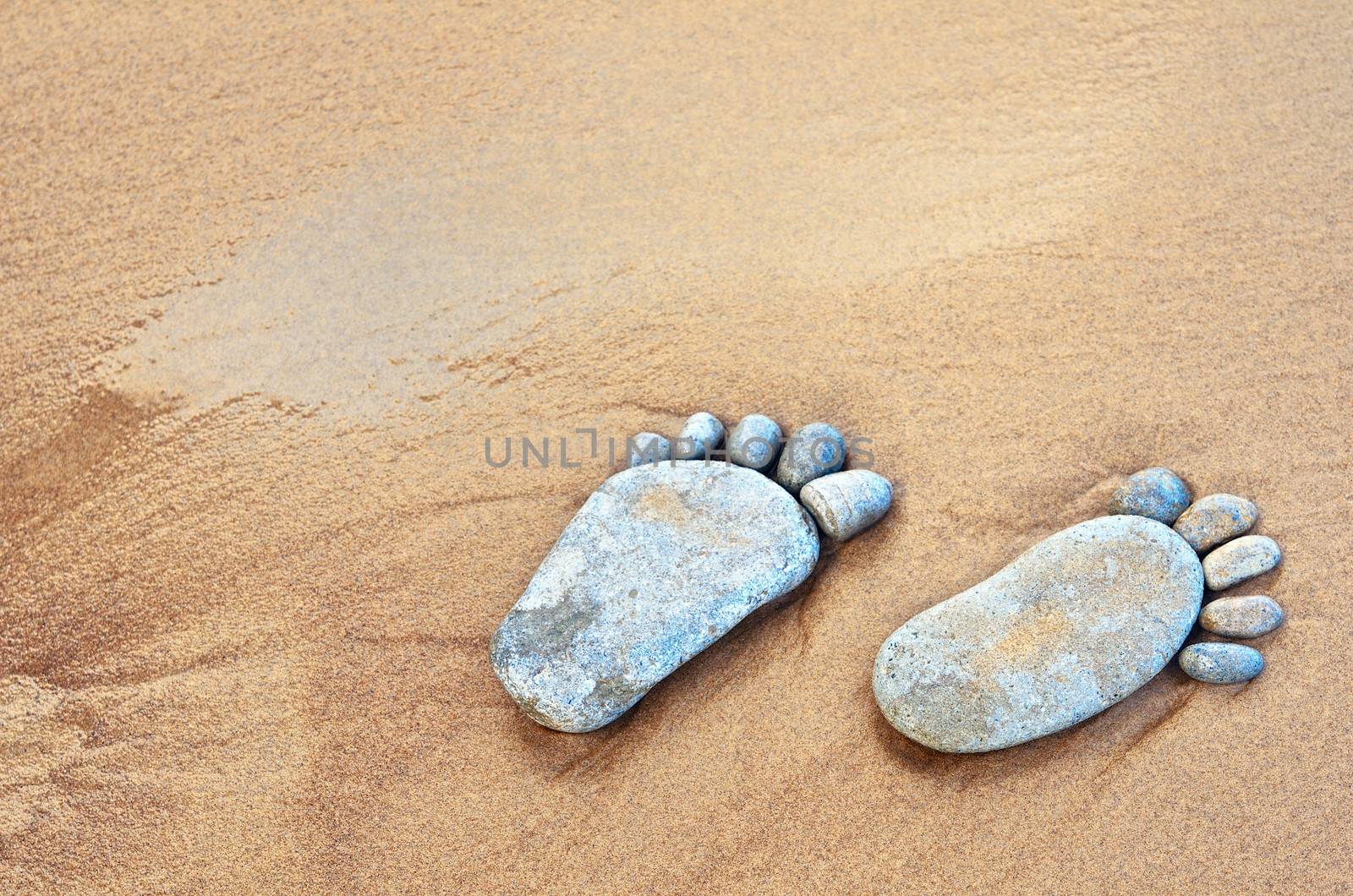 Stone traces of the pebbles on a sandy beach