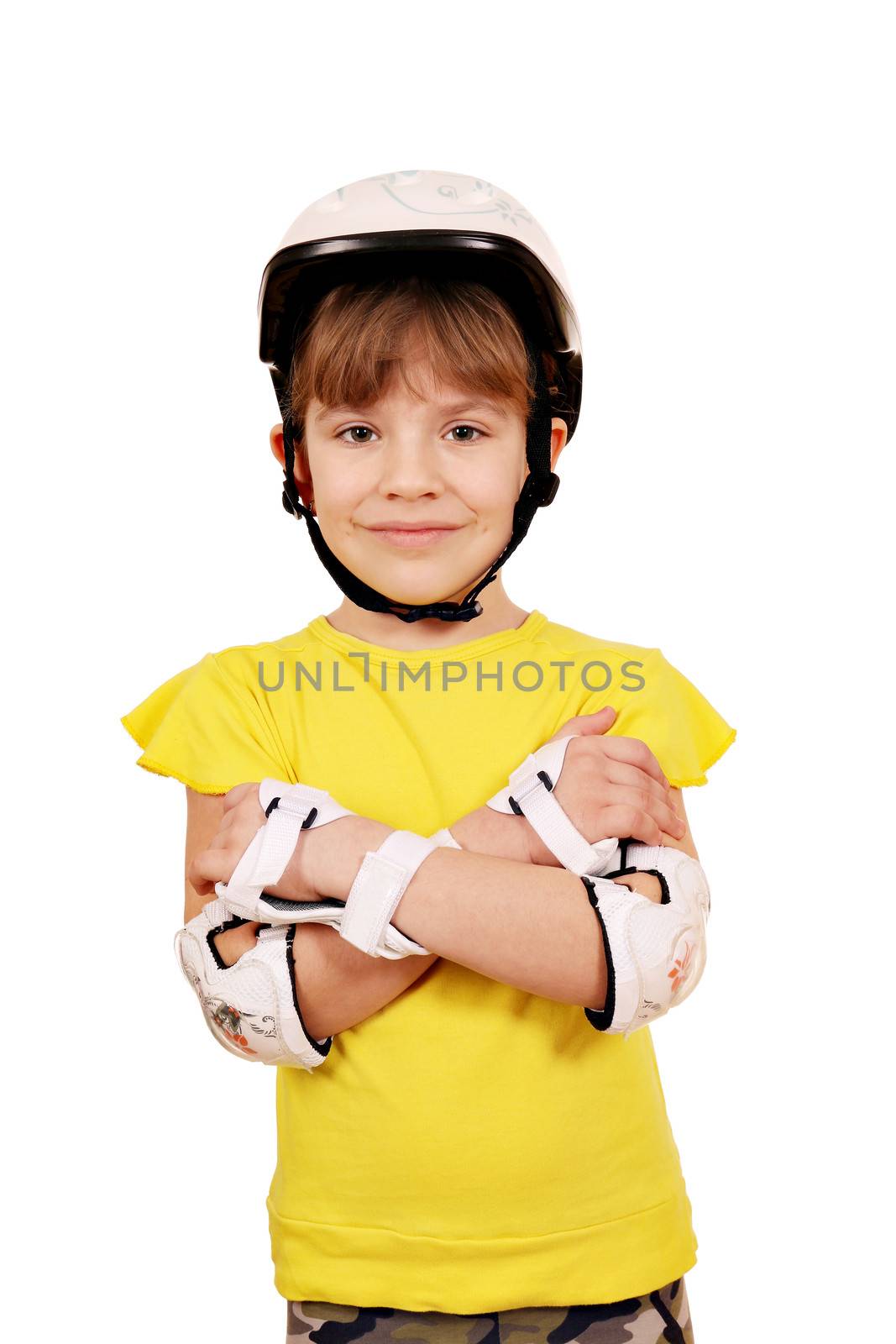 little girl with rolling skates protective gear posing by goce