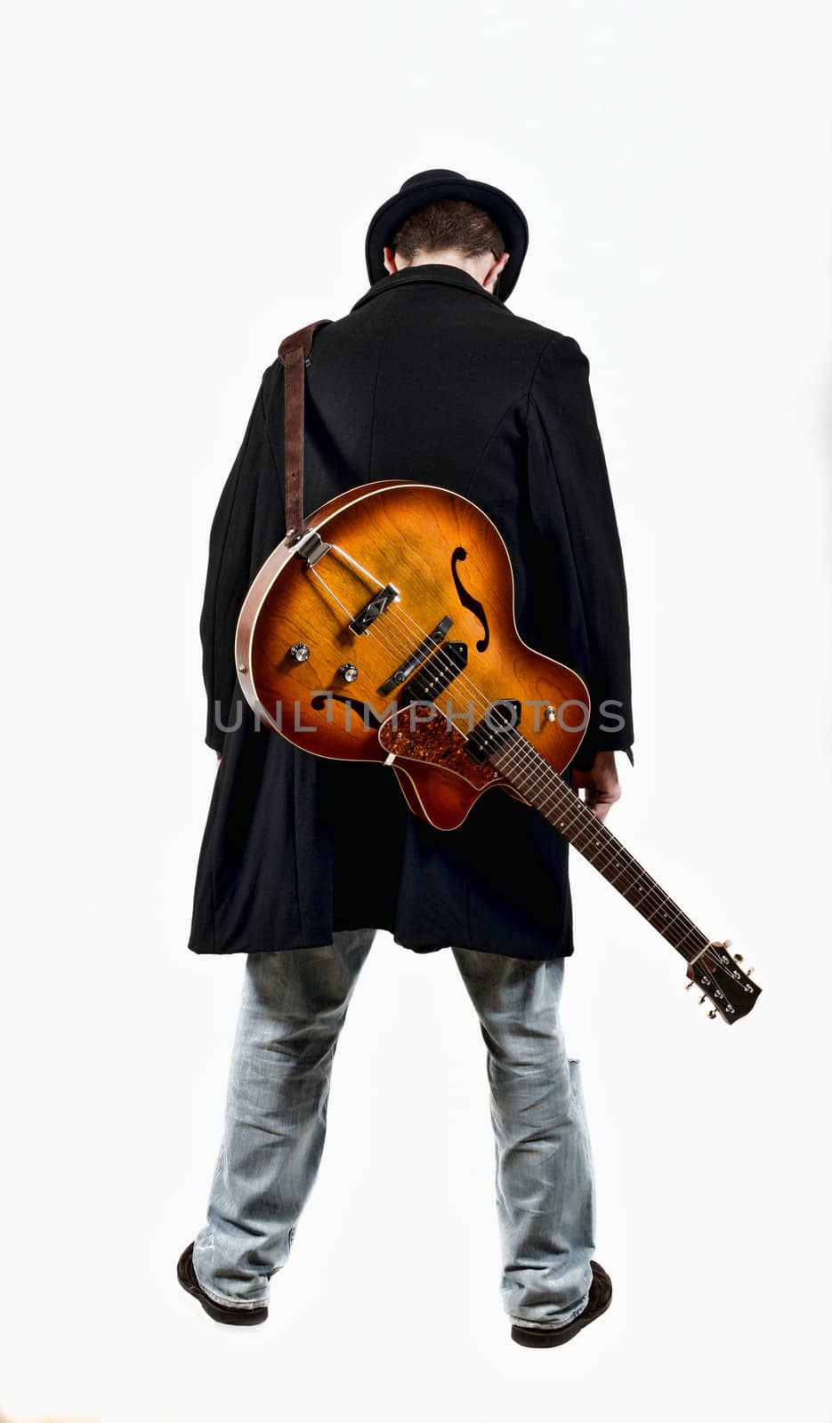  a guitarist with his guitar in the back isolated on white background