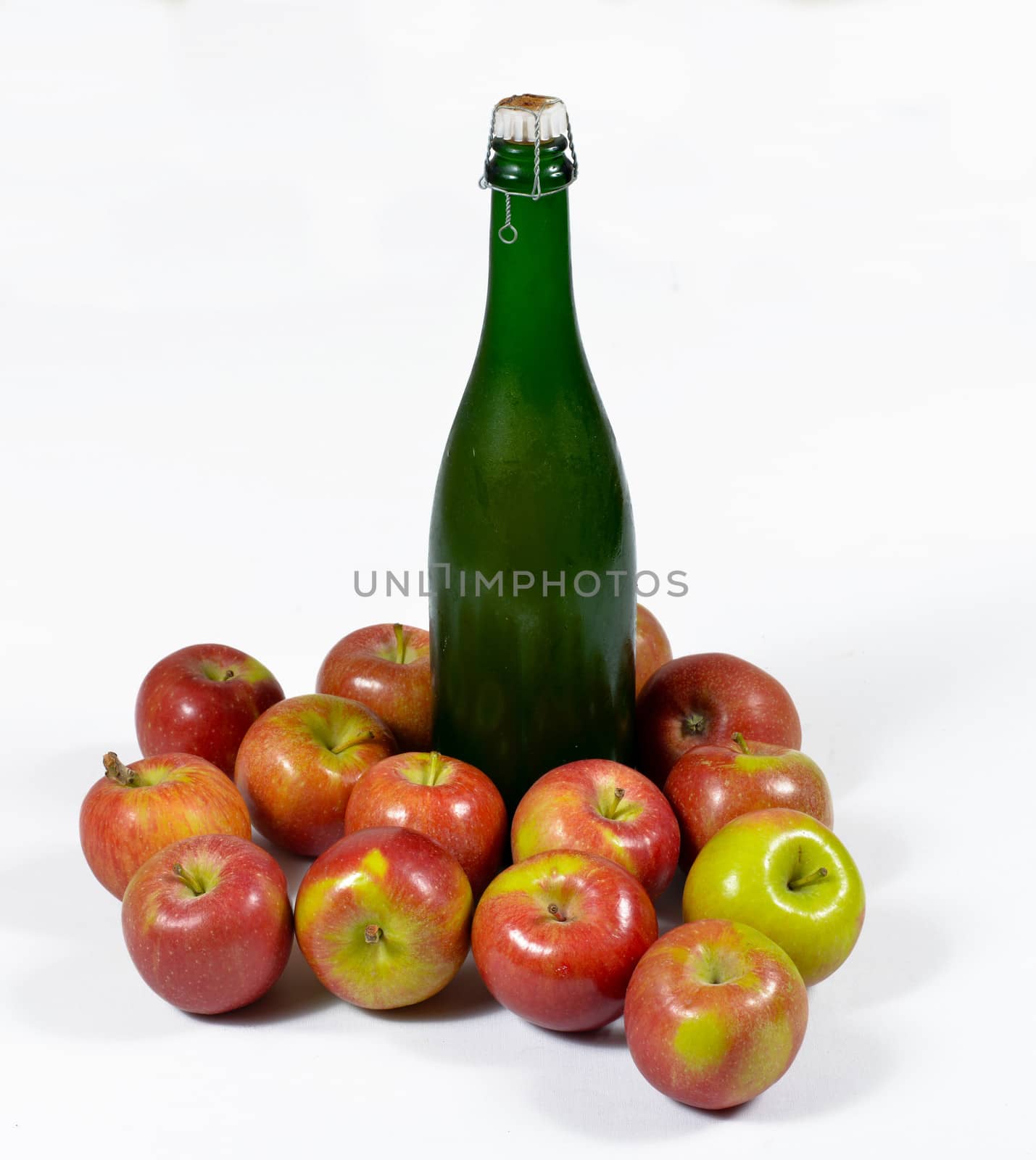 apples with a bottle of Norman cider, isolated on a white background
