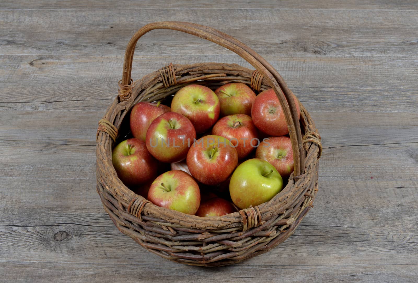 basket of apples on wood table