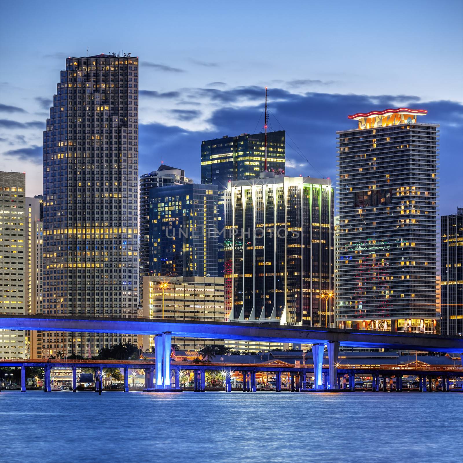 CIty of Miami Florida, illuminated business and residential buildings and bridge on Biscayne Bay 