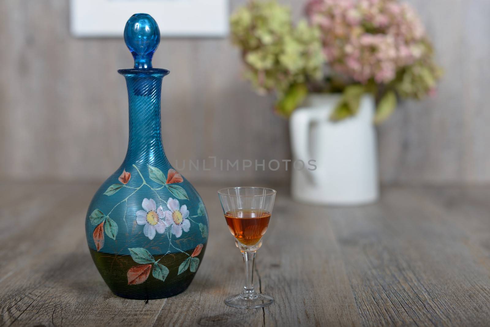 Former decanter with  small glasse with liqueur by philipimage