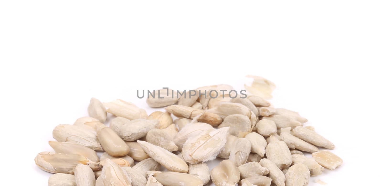 Bunch of pelled sunflower seeds. Whole background.