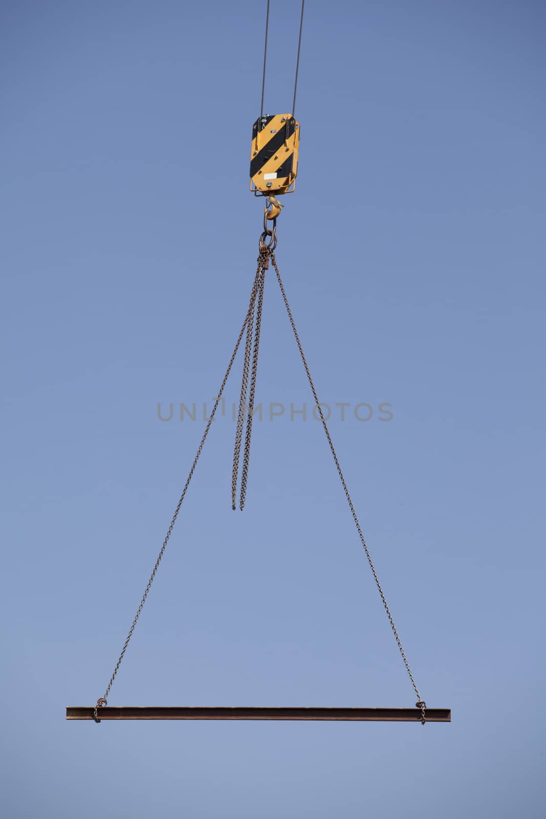 Steel beam swinging from a crane