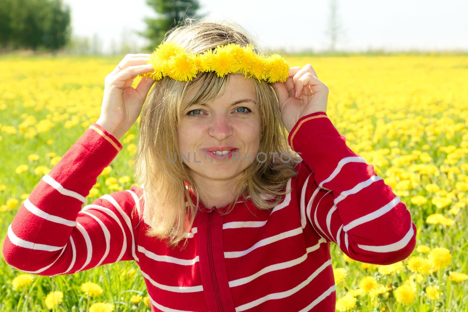 a smiling woman with a dandelion Crown