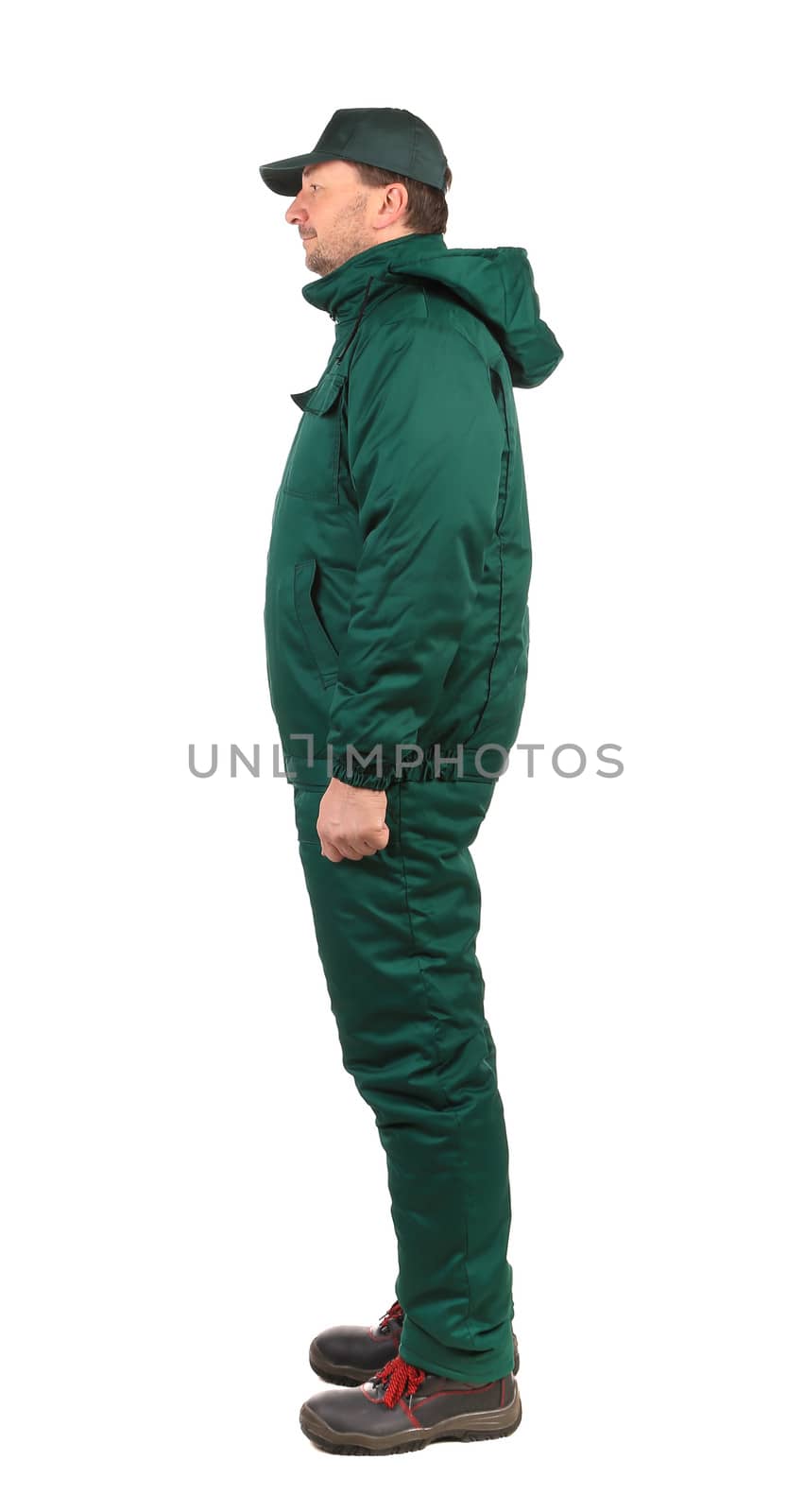 Worker in green overalls. Isolated on a white background.