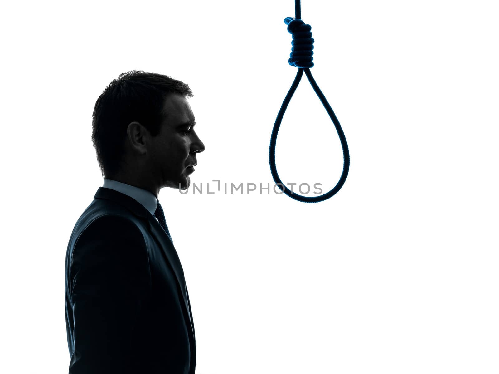 one caucasian business man portrait profile standing in front of hangman's noose in silhouette studio isolated on white background