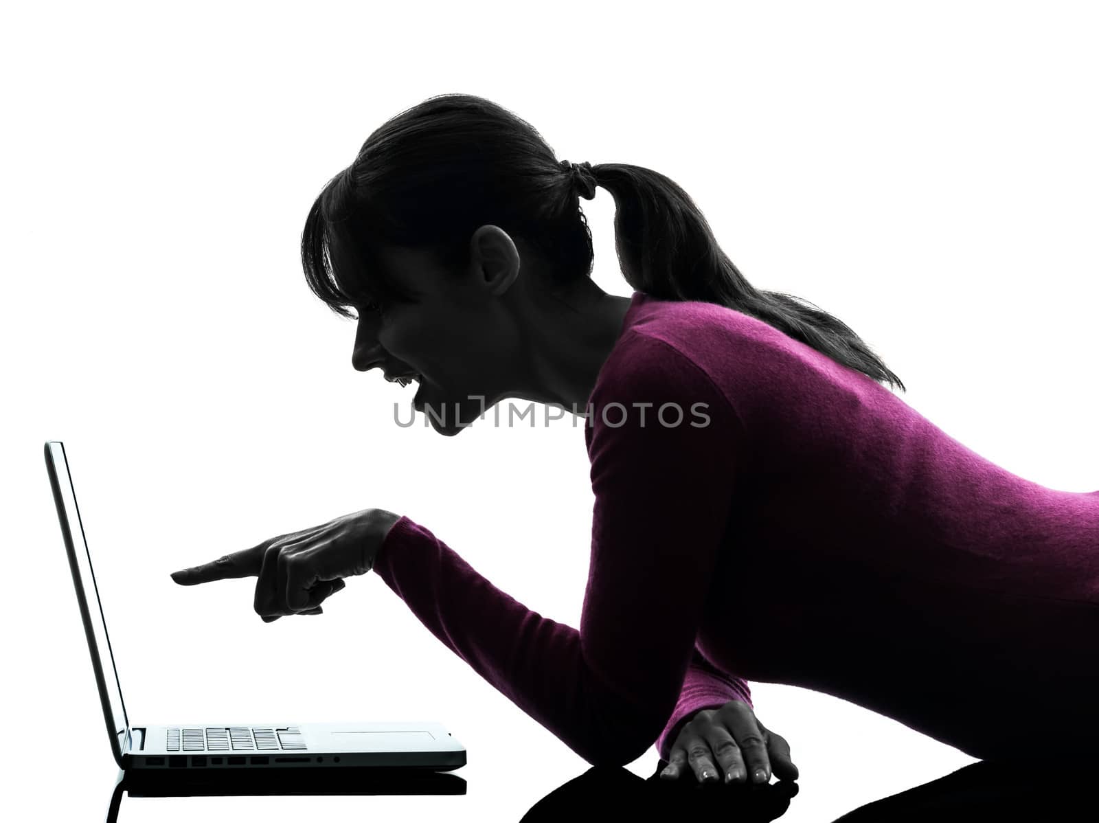 one caucasian woman mouth open pointing computing laptop computer in silhouette studio isolated on white background