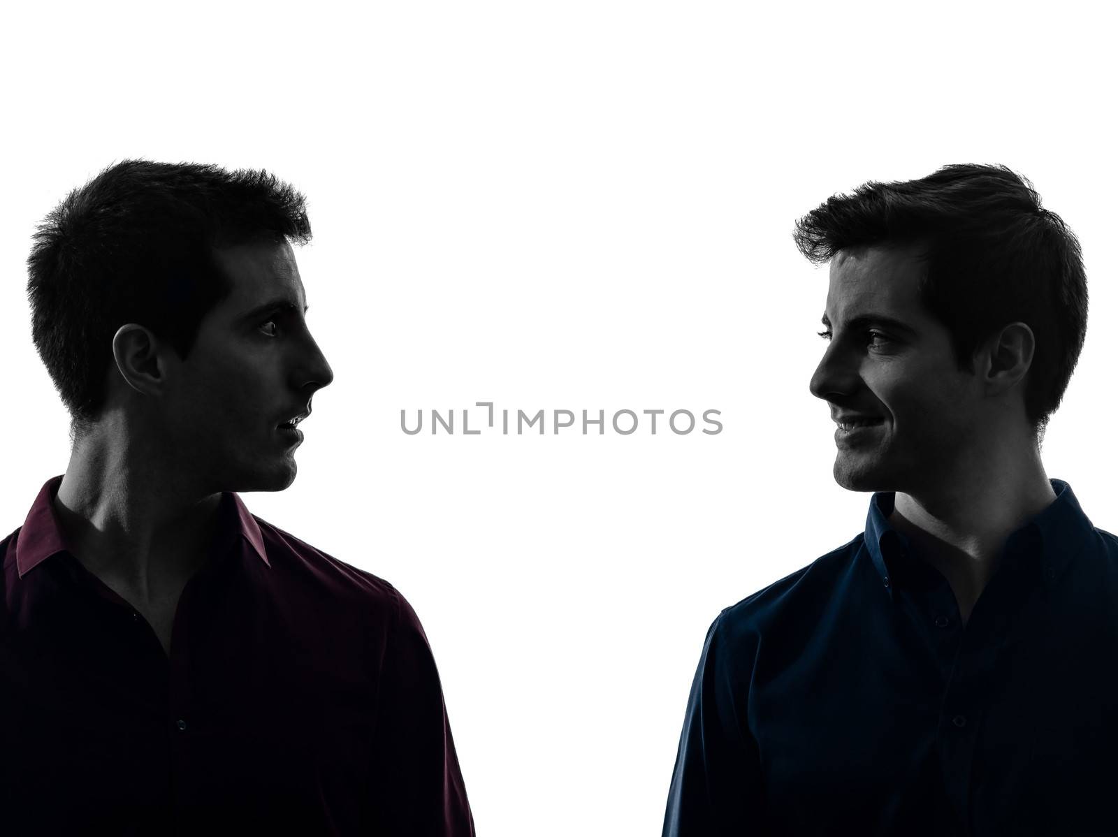 two  men twin brother friends looking at each others silhouette by PIXSTILL
