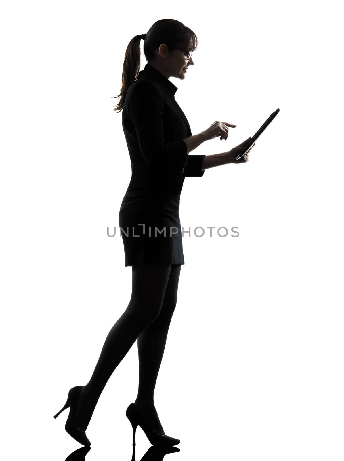one business woman walking computer computing typing digital tablet silhouette studio isolated on white background