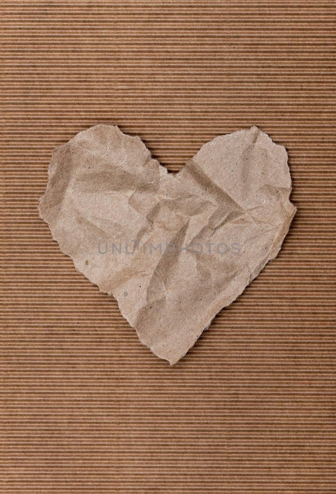 Torn paper heart on a red background