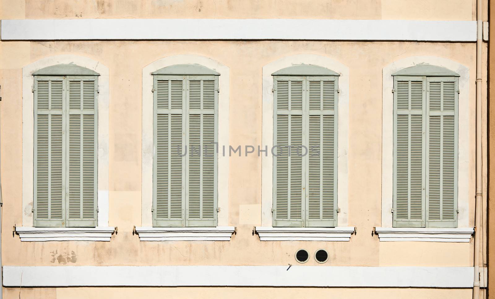 Classic medieval architecture details, windows from Marseille, France