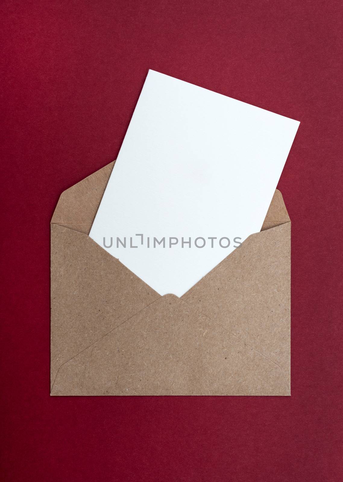 brown envelope on a red background by DNKSTUDIO