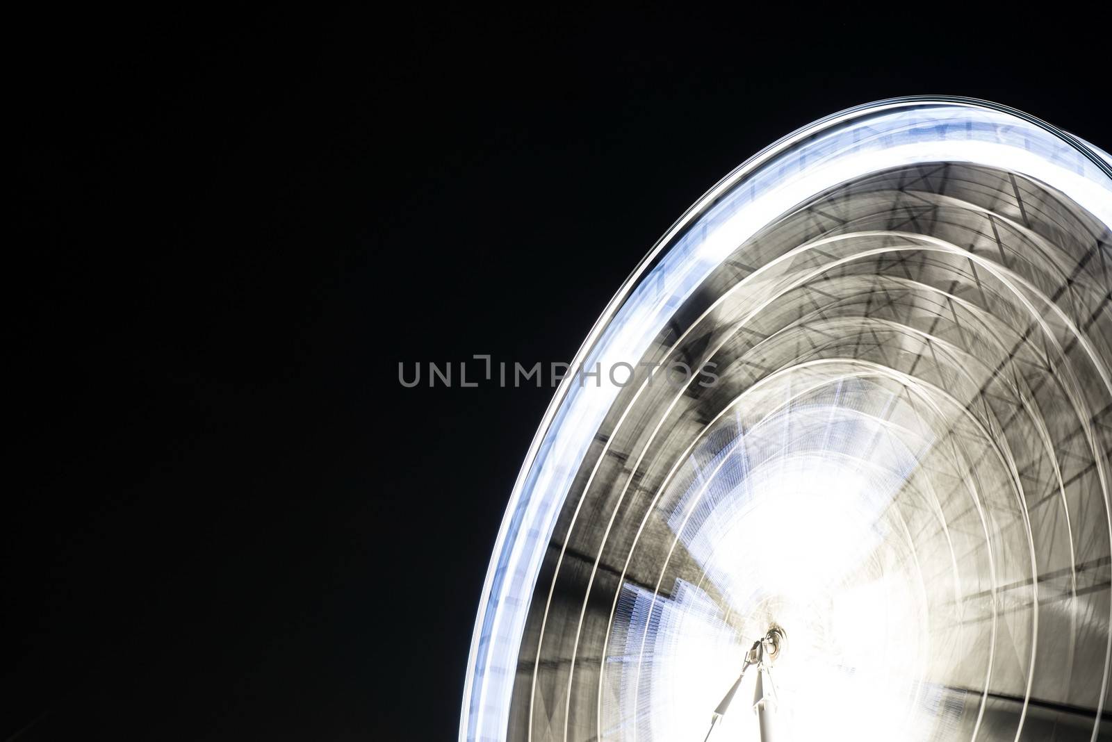 Fairy wheel in an amusement park during night time by sasilsolutions