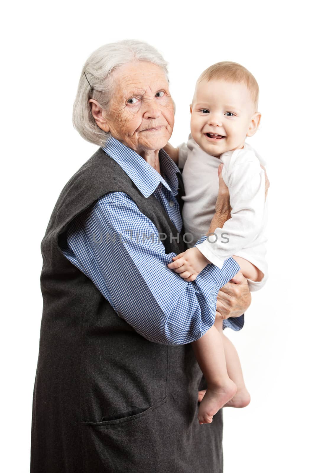 Portrait of a senior grandmother holding grandson by photobac