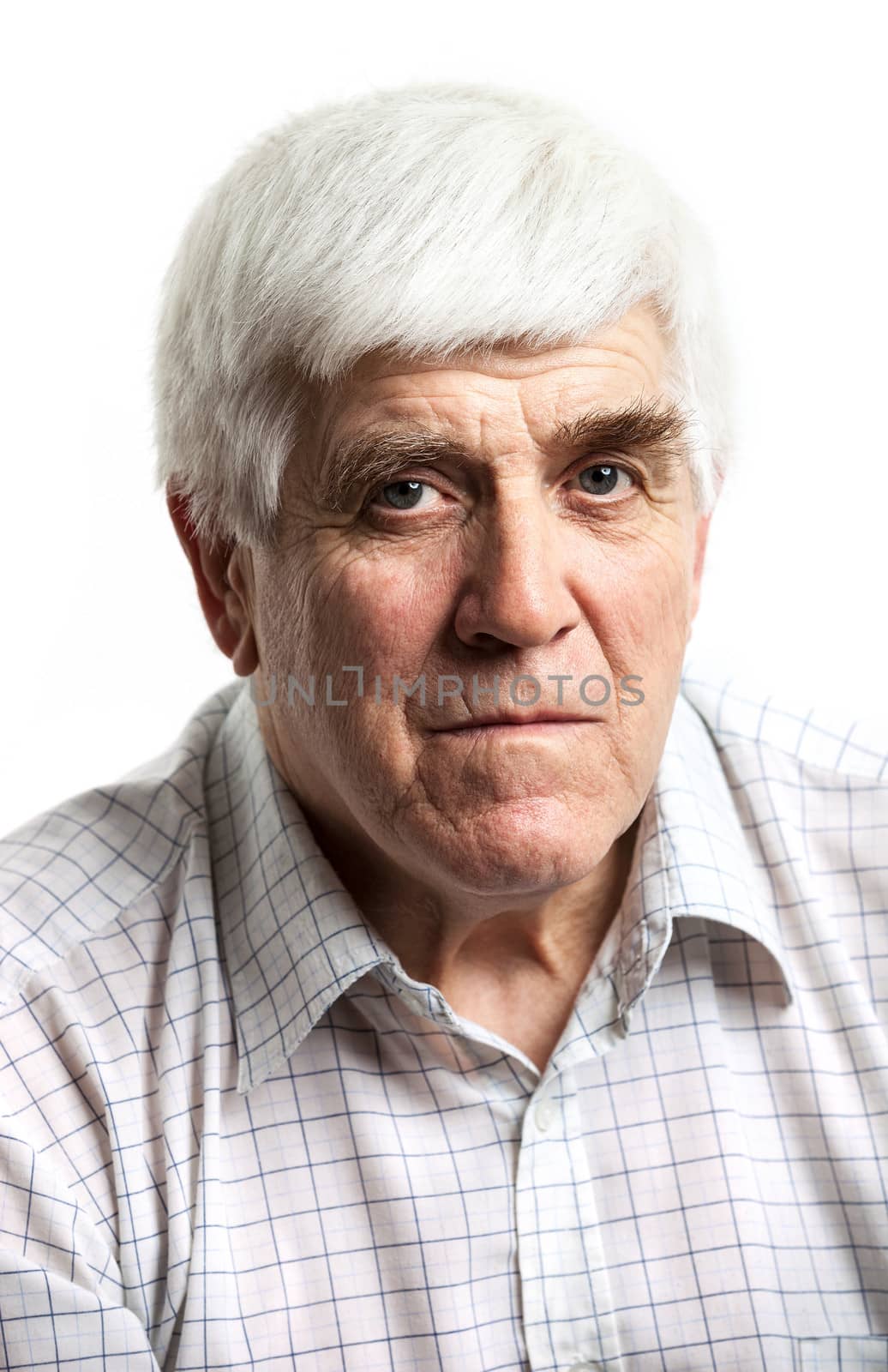 Portrait of a handsome mature man looking at camera. Isolated on white background