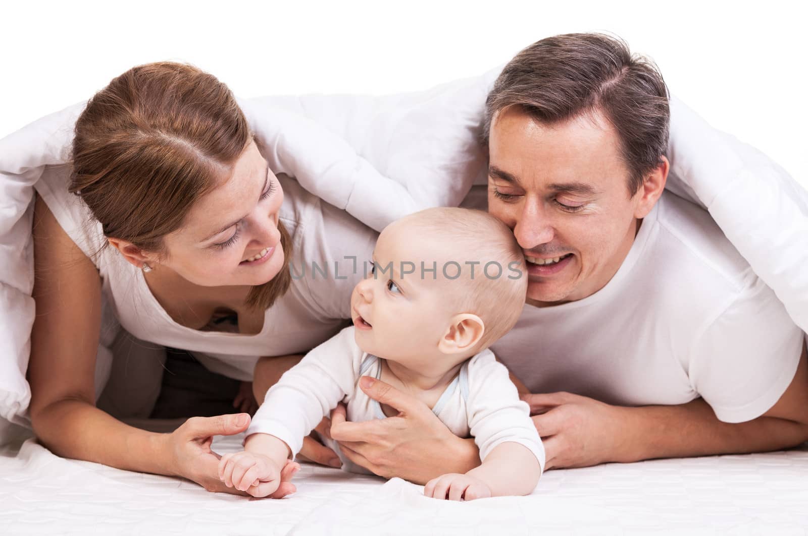 Closeup of young family with baby boy against white background