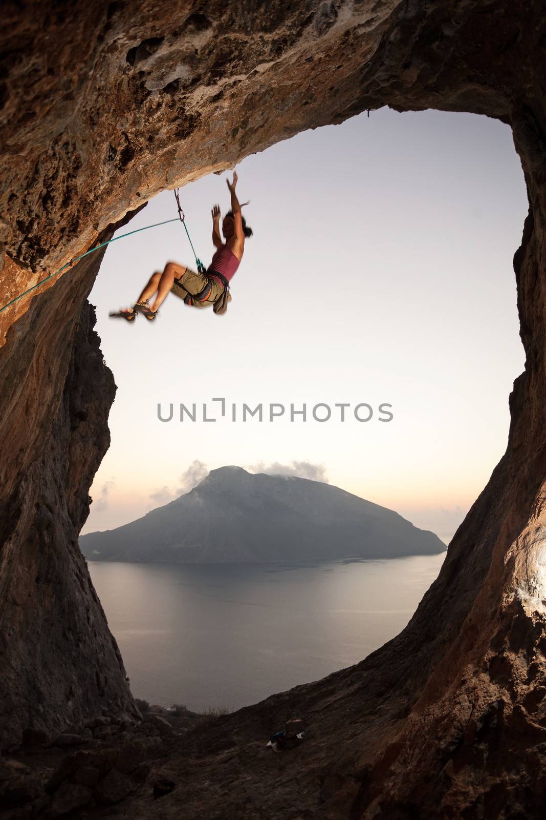 Climber falling of a cliff while lead climbing by photobac