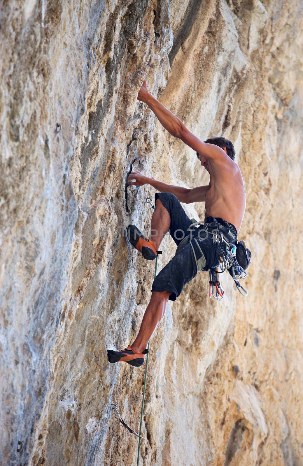 Rock climber on a face of a cliff